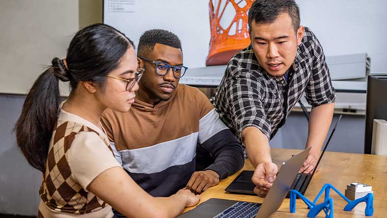 Teacher and students work with Fusion 360 in the CNC lab at Diablo Valley College in Pleasant Hill, California.